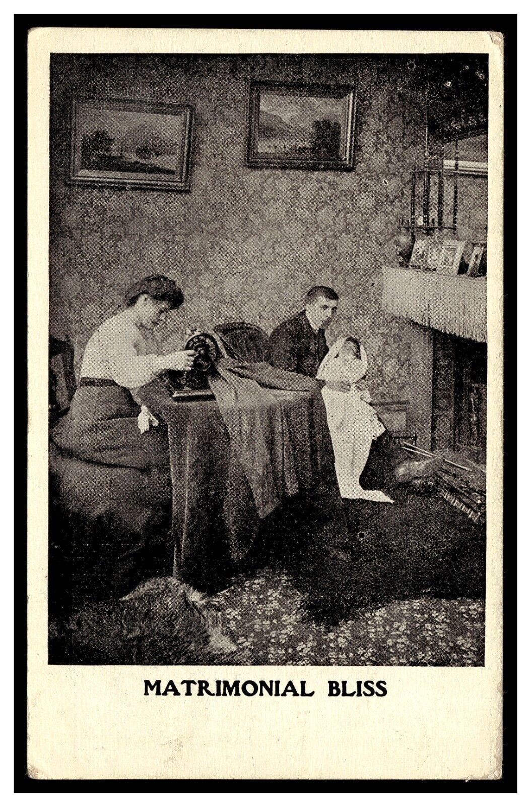MATRIMONIAL BLISS POSTCARD 1900\'S WOMAN SEWING MACHINE MAN W/ BABY IN LAP IMAGE