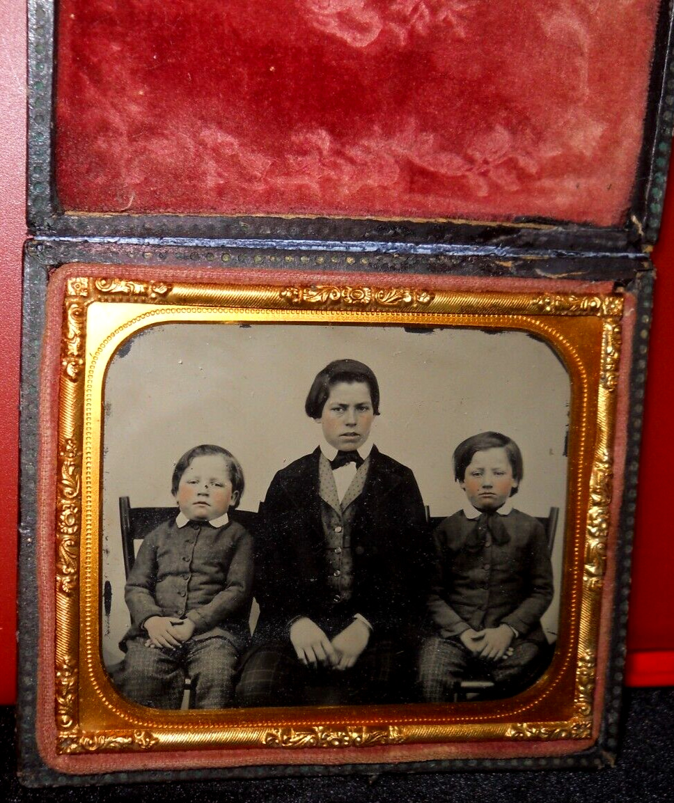 1/6th size Ambrotype of three siblings in full case