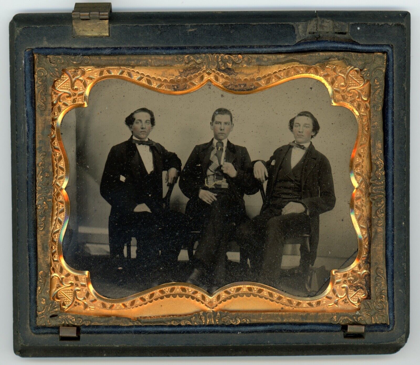 Quarter plate ambrotype of three young gentleman, twins or brothers, classmates?