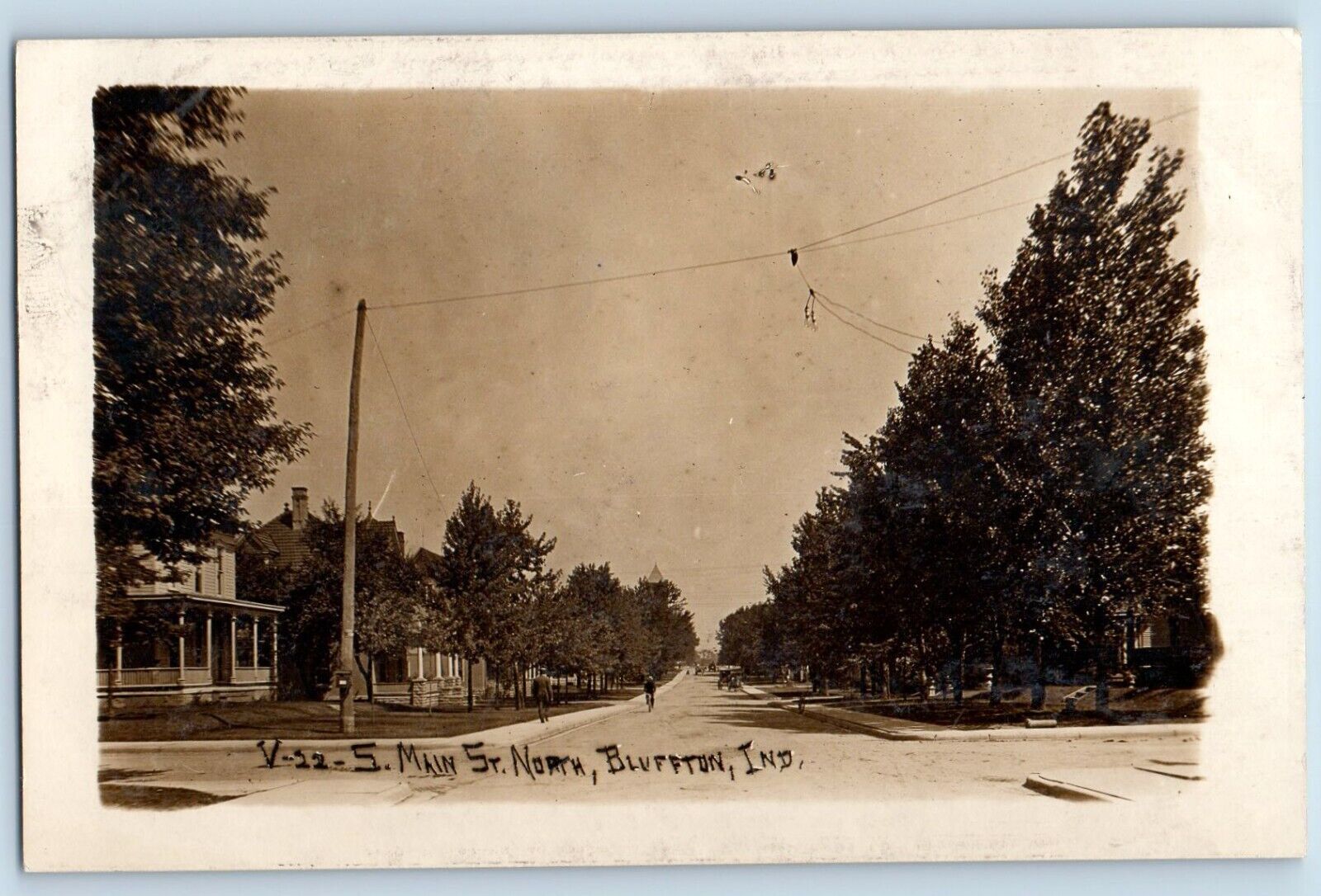 Bluffton Indiana IN Postcard RPPC Photo Main Street North Bicycle Cars c1910's