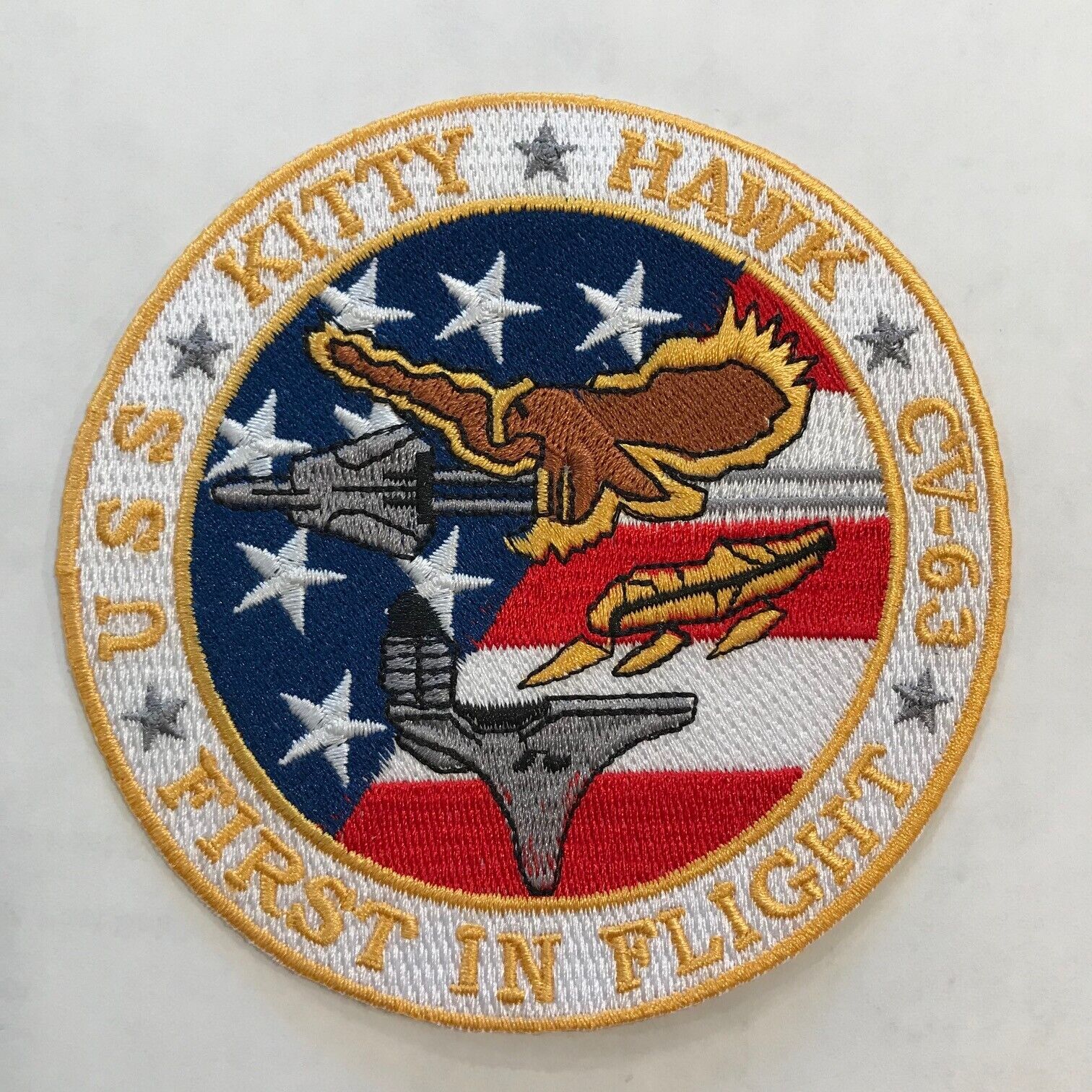 Ship\'s crest patch of USS KITTY HAWK (CV-63) FIRST IN FLIGHT