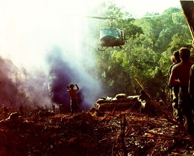 U.S. Soldier guiding a UH-1B Huey Helicopter 8\