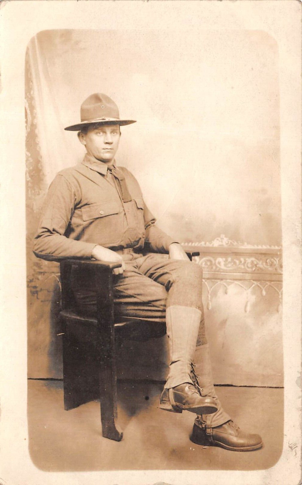 RPPC US Army Soldier Sitting in Chair AZO Photo c1918 Postcard