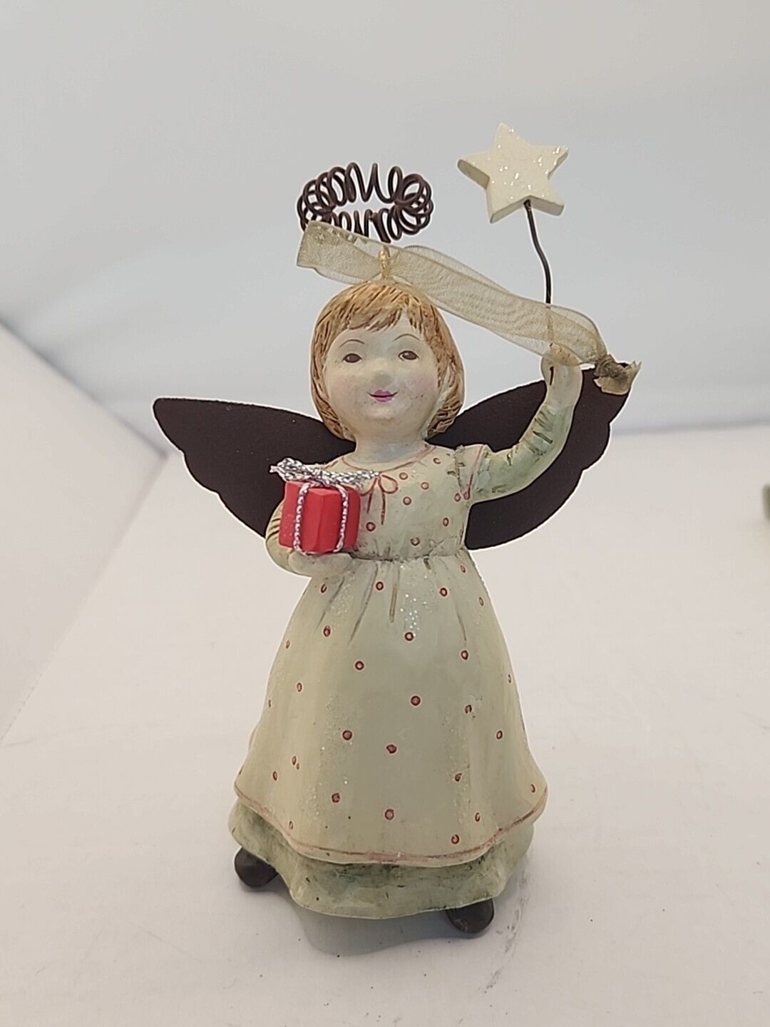 NEW- Hallmark Ceramic Angel With Metal Wings Holding Present Christmas Ornament
