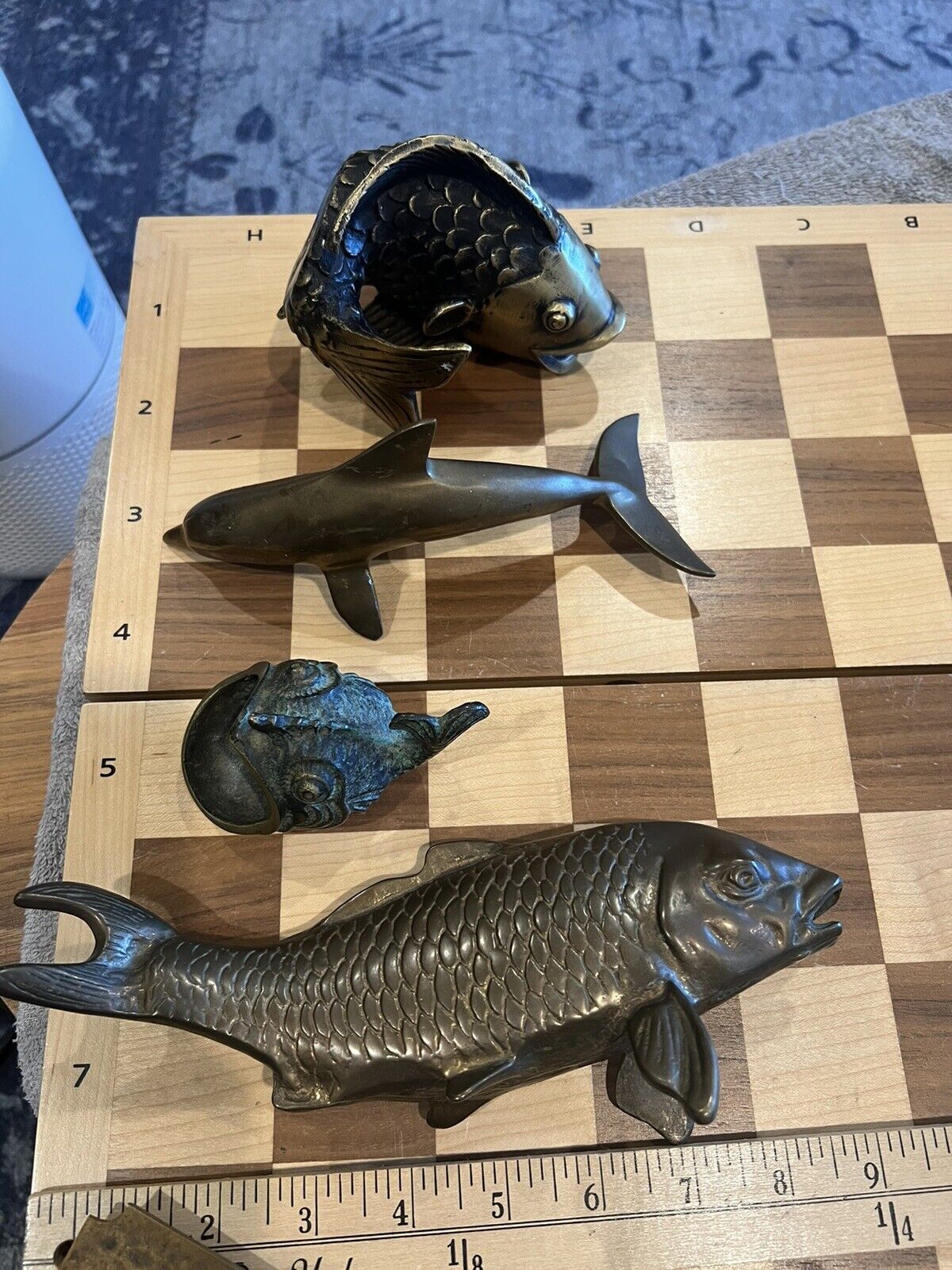 brass fish  3 brass fish sculptures statues 1 brass dolphin sculpture. 1 ashtray