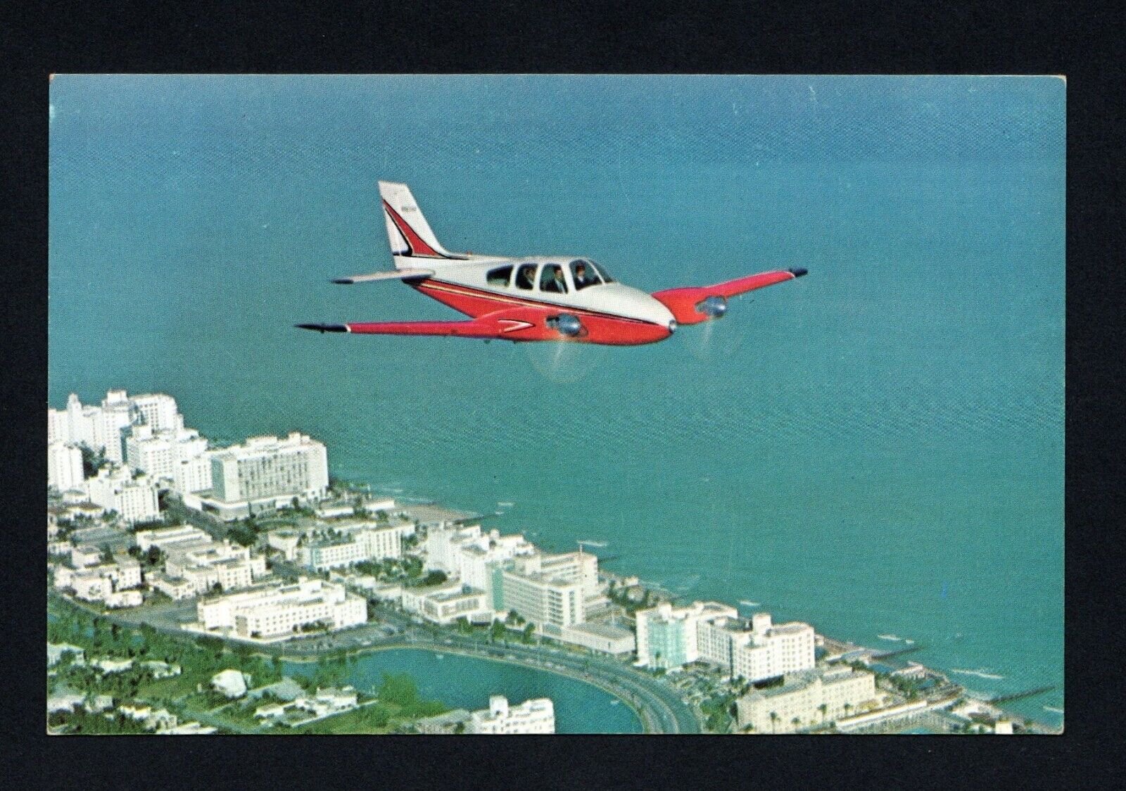 Beechcraft Model 55 Baron Over Miami Beach Florida Postcard 5.5
