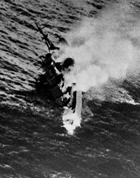The British cruiser HMS Exeter goes down after heavy Japanese bomb- Old Photo