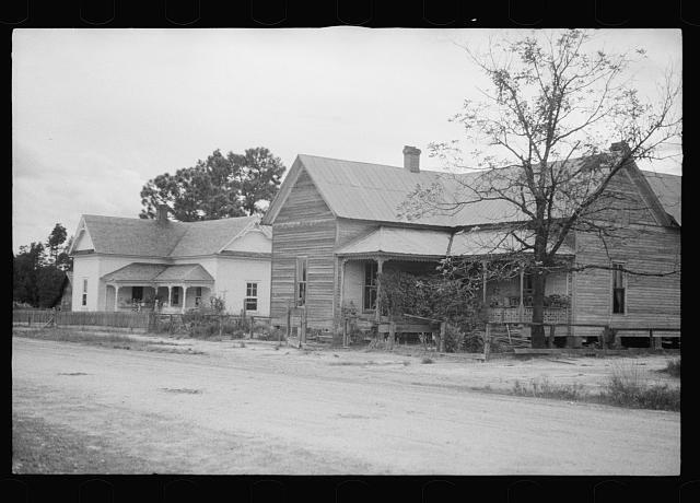 Photo:Old house with remodeled house in background, Irwin County, Georgia