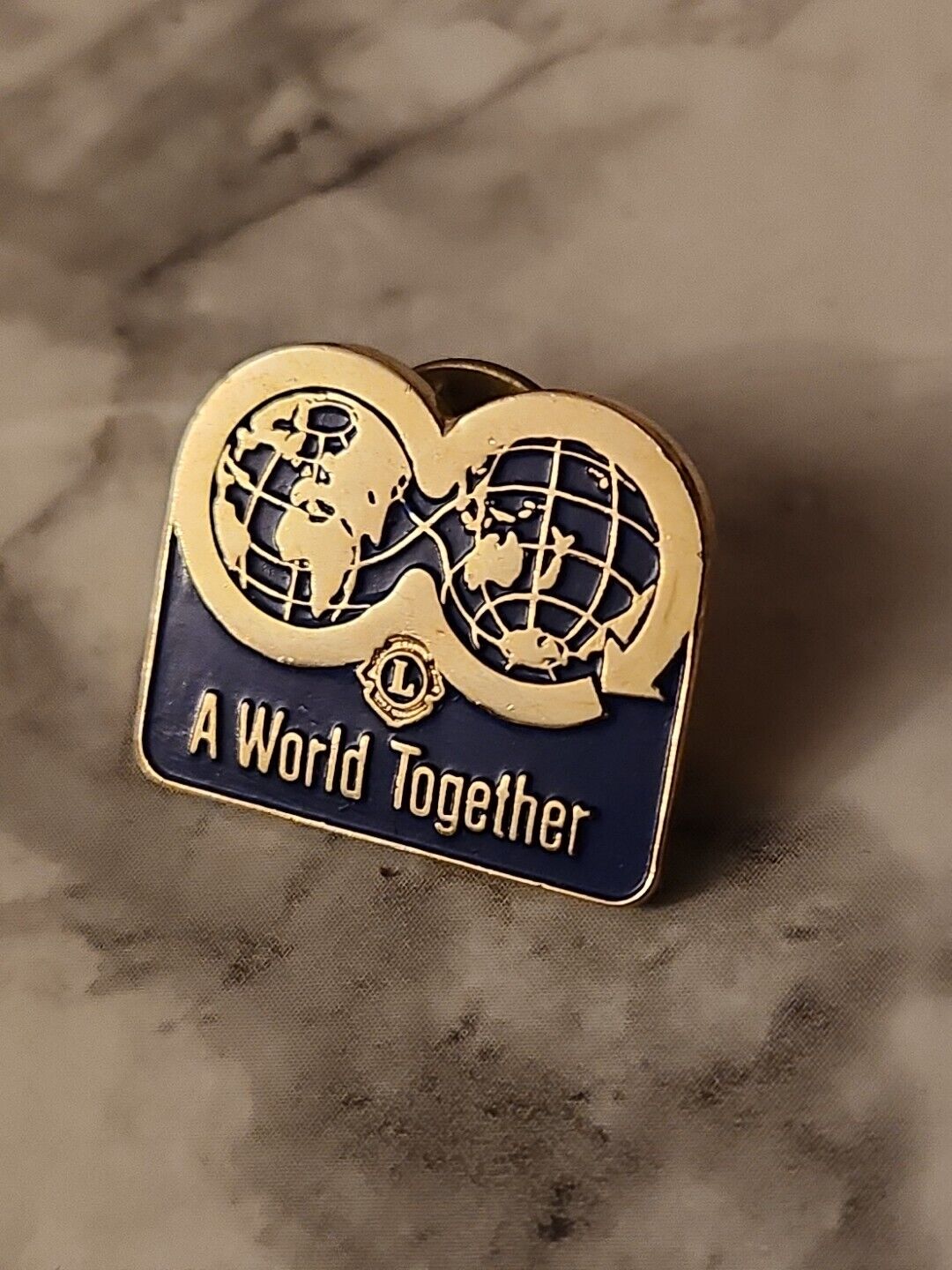Vintage Lions Club International  World Together Gold Tone Lapel Hat Lanyard Pin