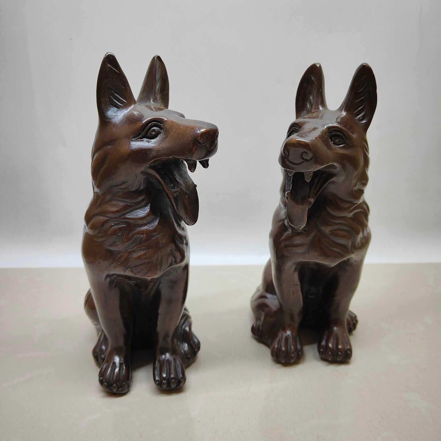 A pair of brass imitation purple copper Wangcai dogs