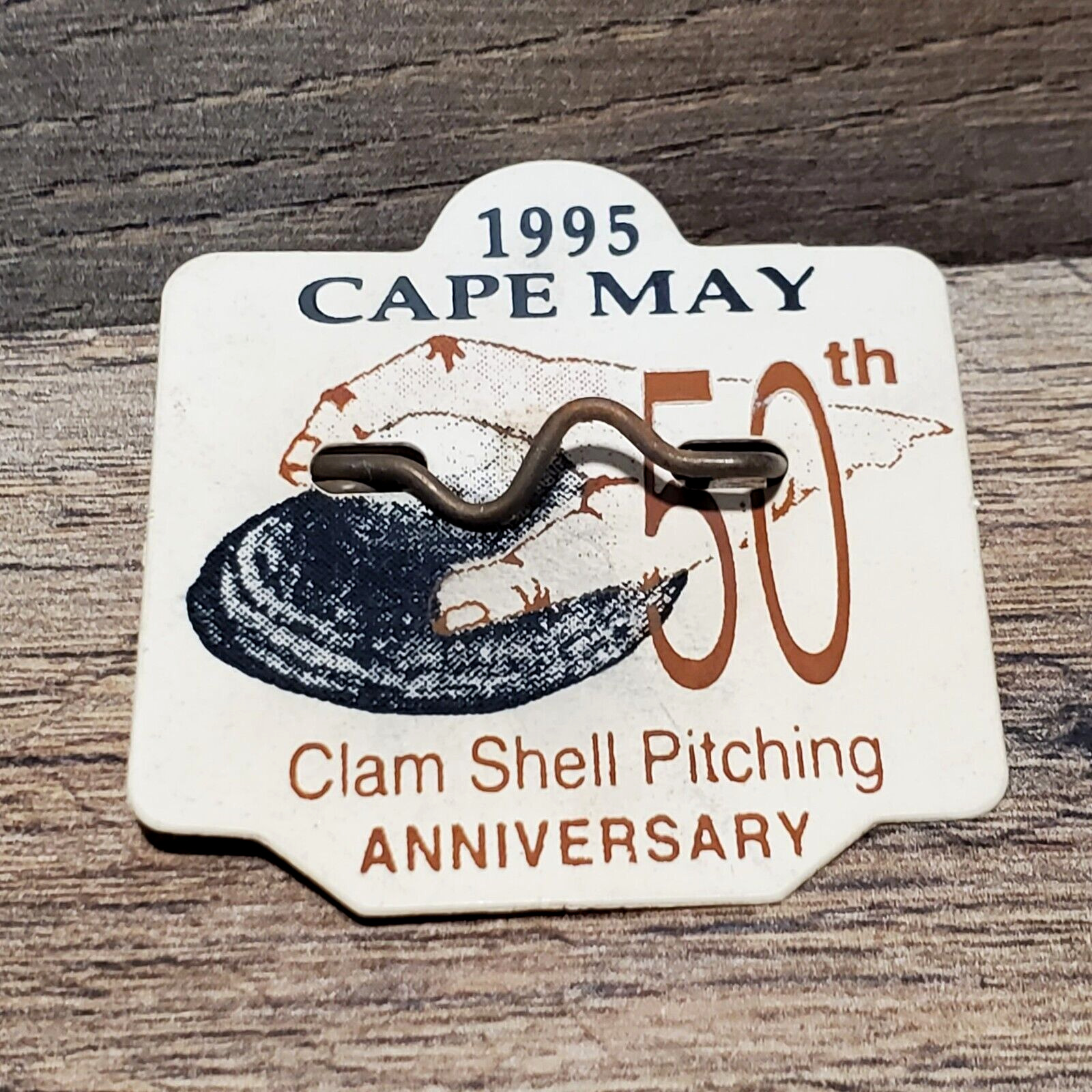 1995 Cape May NJ Seasonal Beach Tag Badge 50th Anniversary Clam Shell Pitching