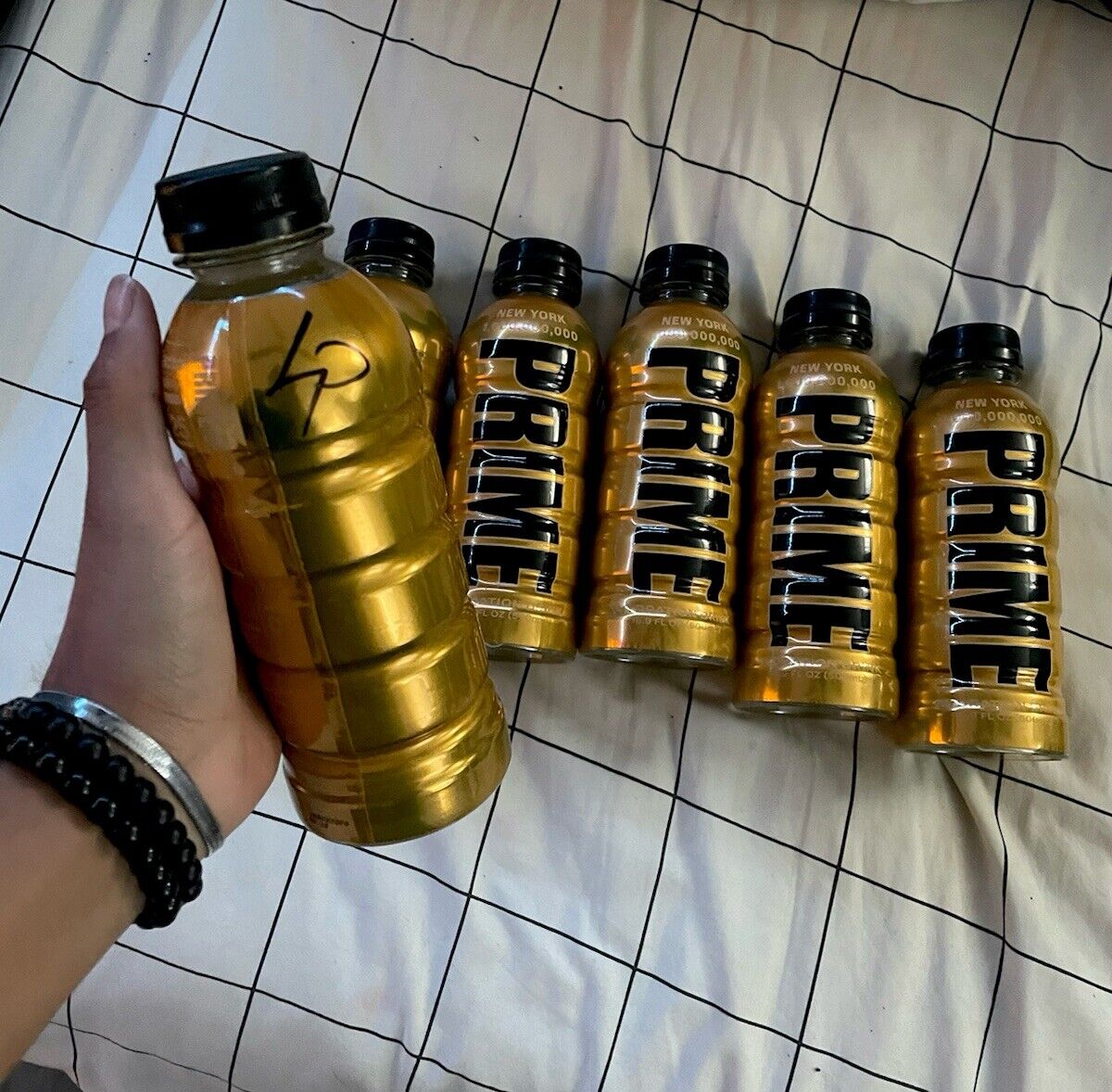 Gold PRIME Limited Edition NYC Bottle And Hat (6 Available, 1 Logan Paul Signed)