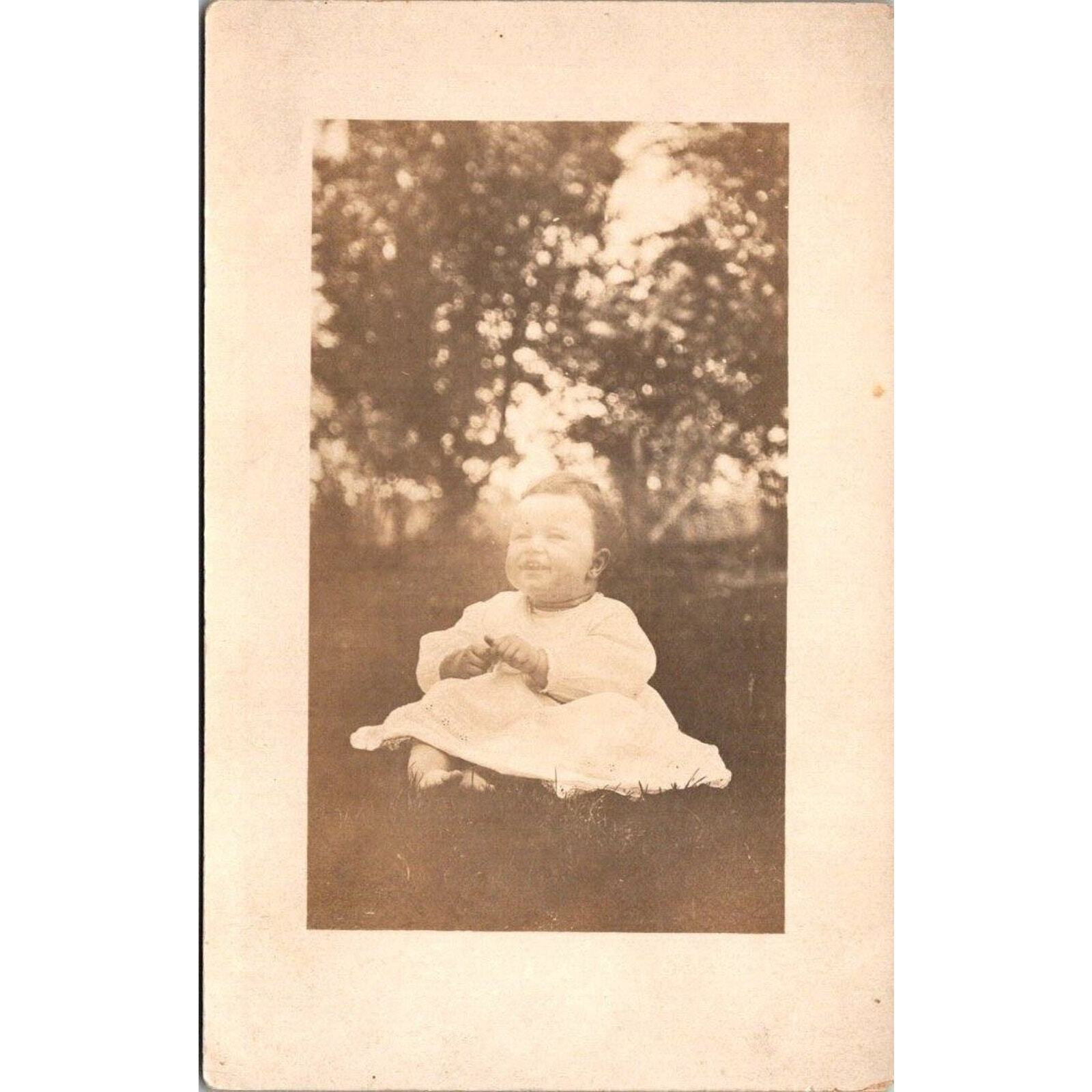 RPPC Smiling Baby Outside in Dress Azo Vintage Postcard Real Photo