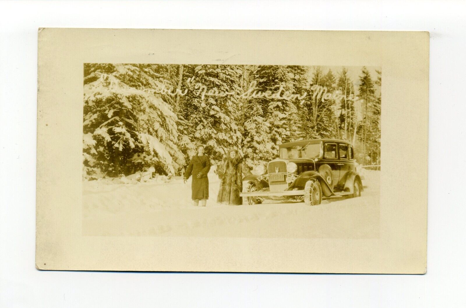 New Sweden ME 1934 RPPC photo postcard, people, car, heavy snow, Maine Humor