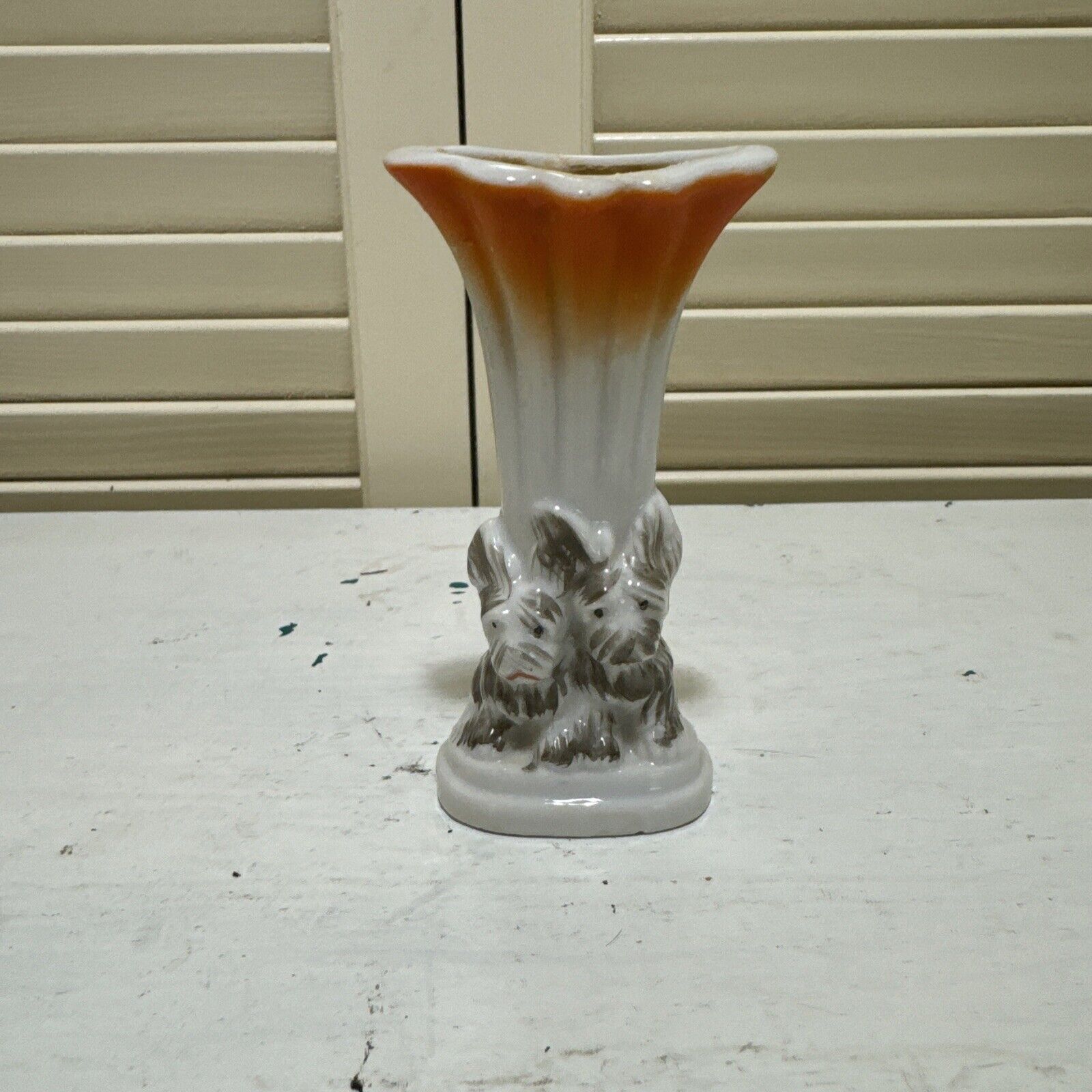 Vintage Miniture Ceramic Vase with a Pair of Puppy Dogs at the Bottom.