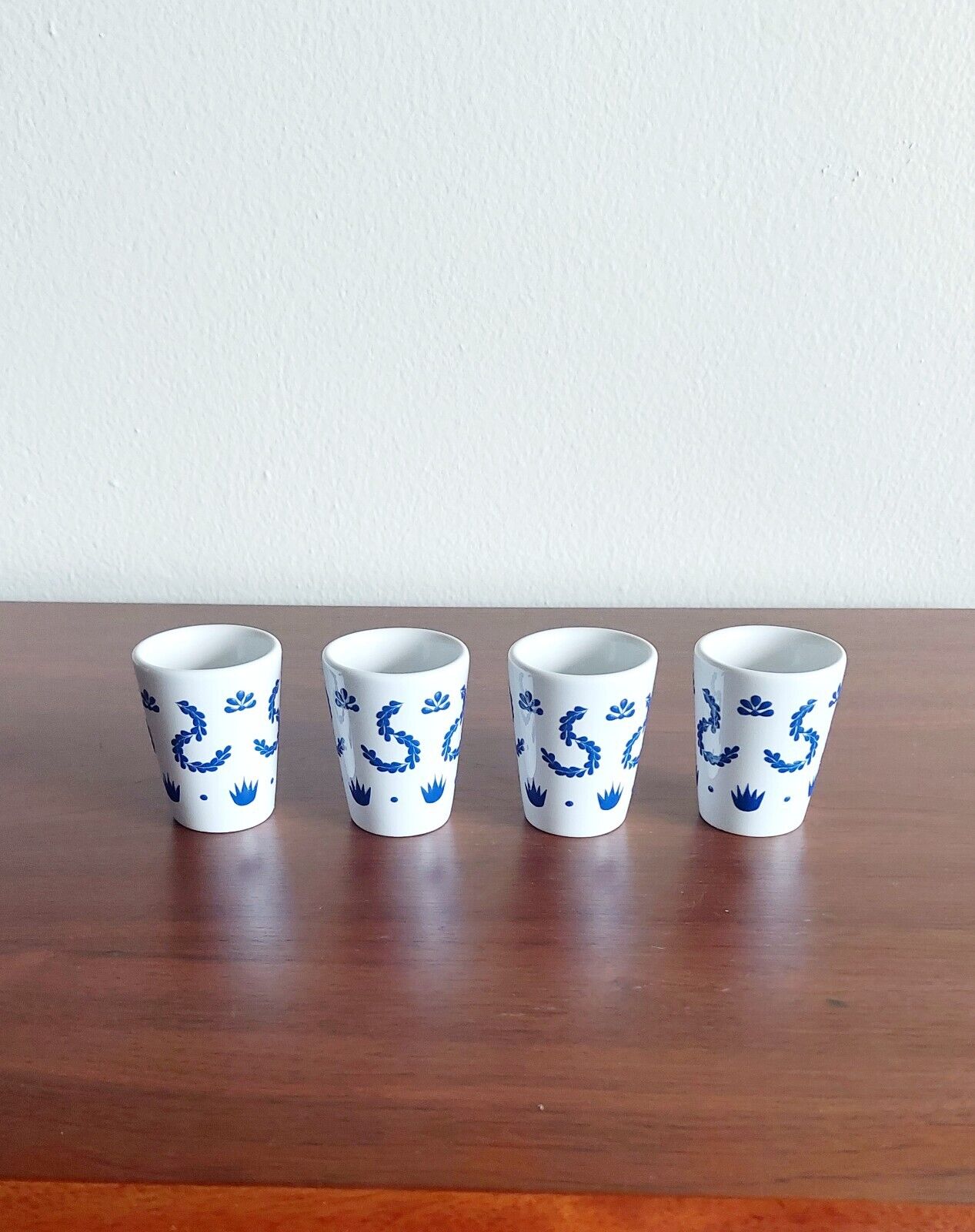 4 blue class style shot glasses, without the bottle