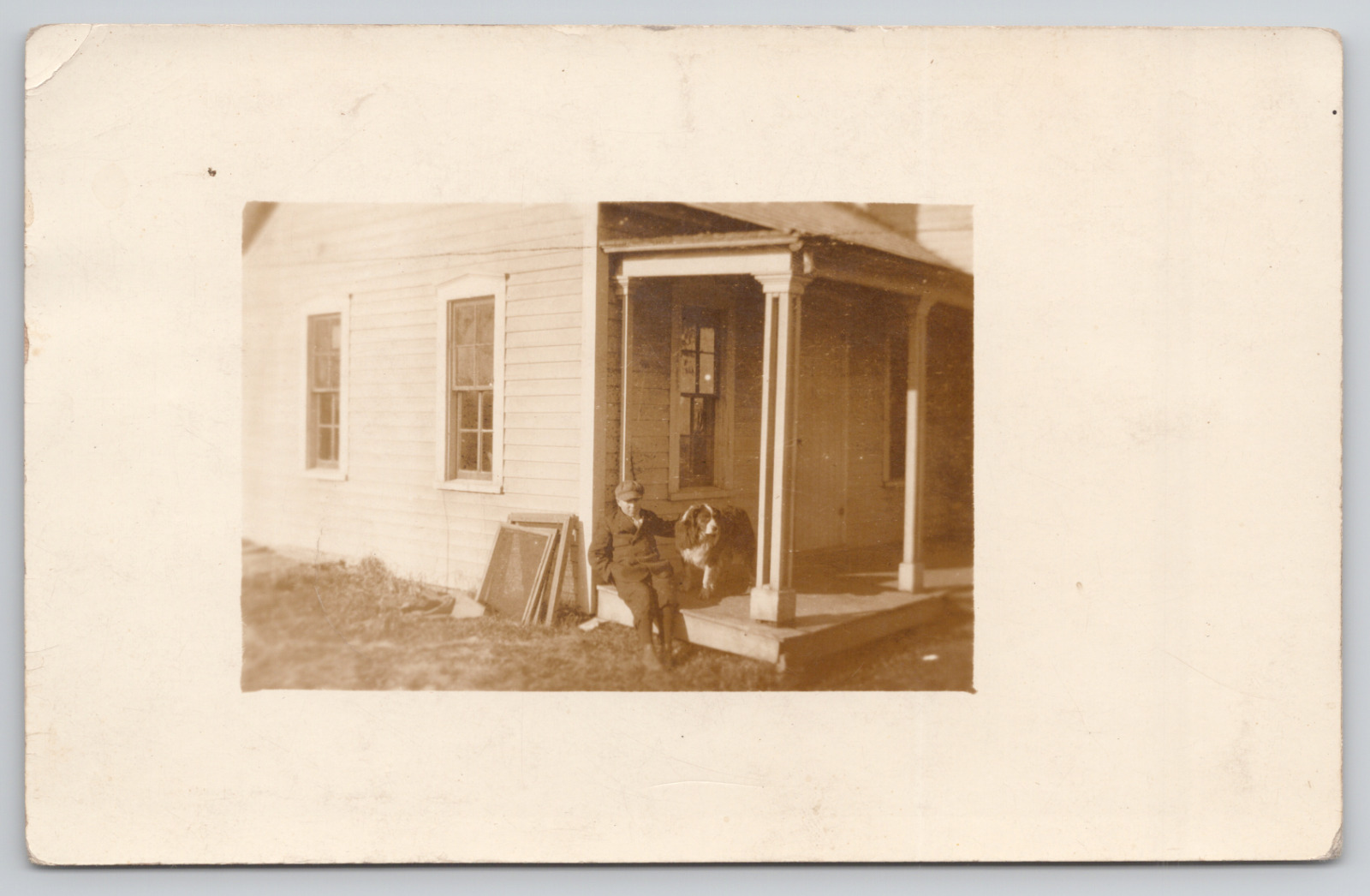Real Photo Postcard Man on Porch with Shepherd Dog c1910 RPPC