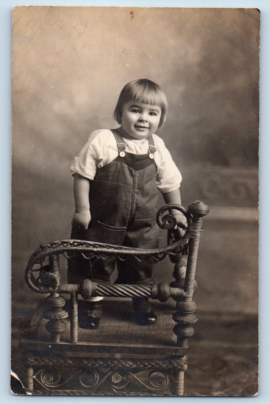 Cute Baby Postcard RPPC Photo Wicker Chair Overalls Studio c1910\'s Unposted