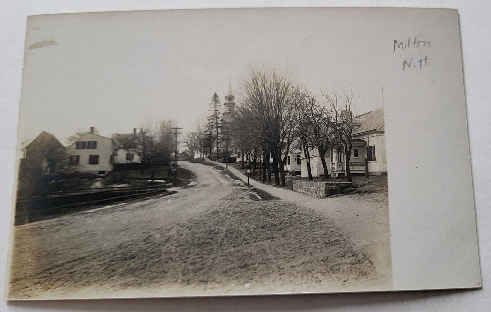 C 1903 RPPC MAIN STREET LEADING INTO MILTON VILLAGE NH SNOW REMNANTS EXC