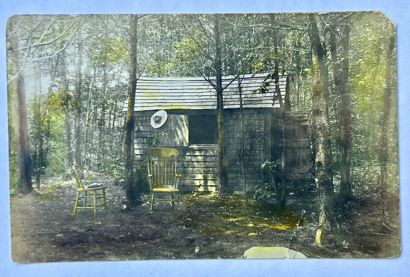 Cabin In Woods. Cowboy Hat And Chairs. RPPC? Vintage Postcard