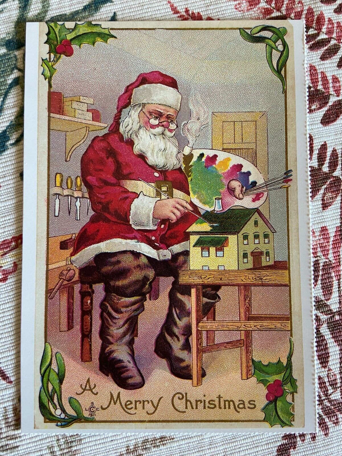 vintage Christmas postcard  Santa toy bench painting art  reproduced