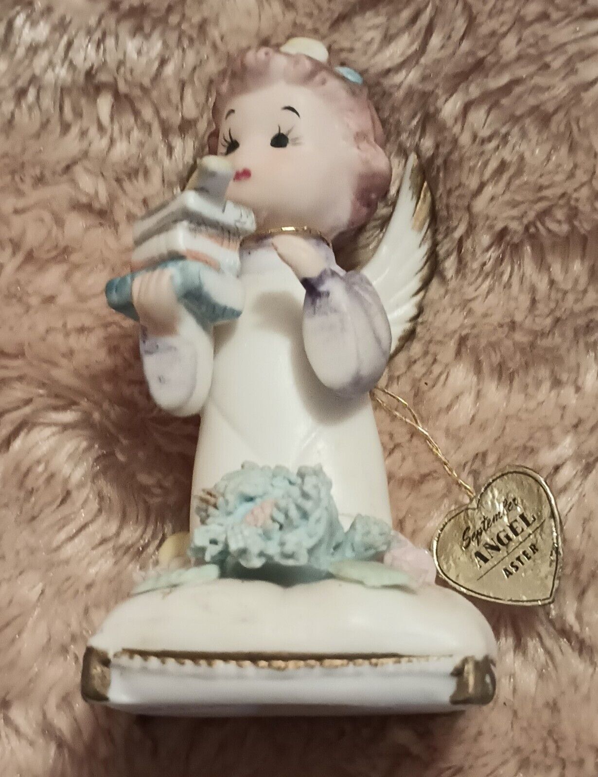 An Angel Holding Books By Narco, International Potteries