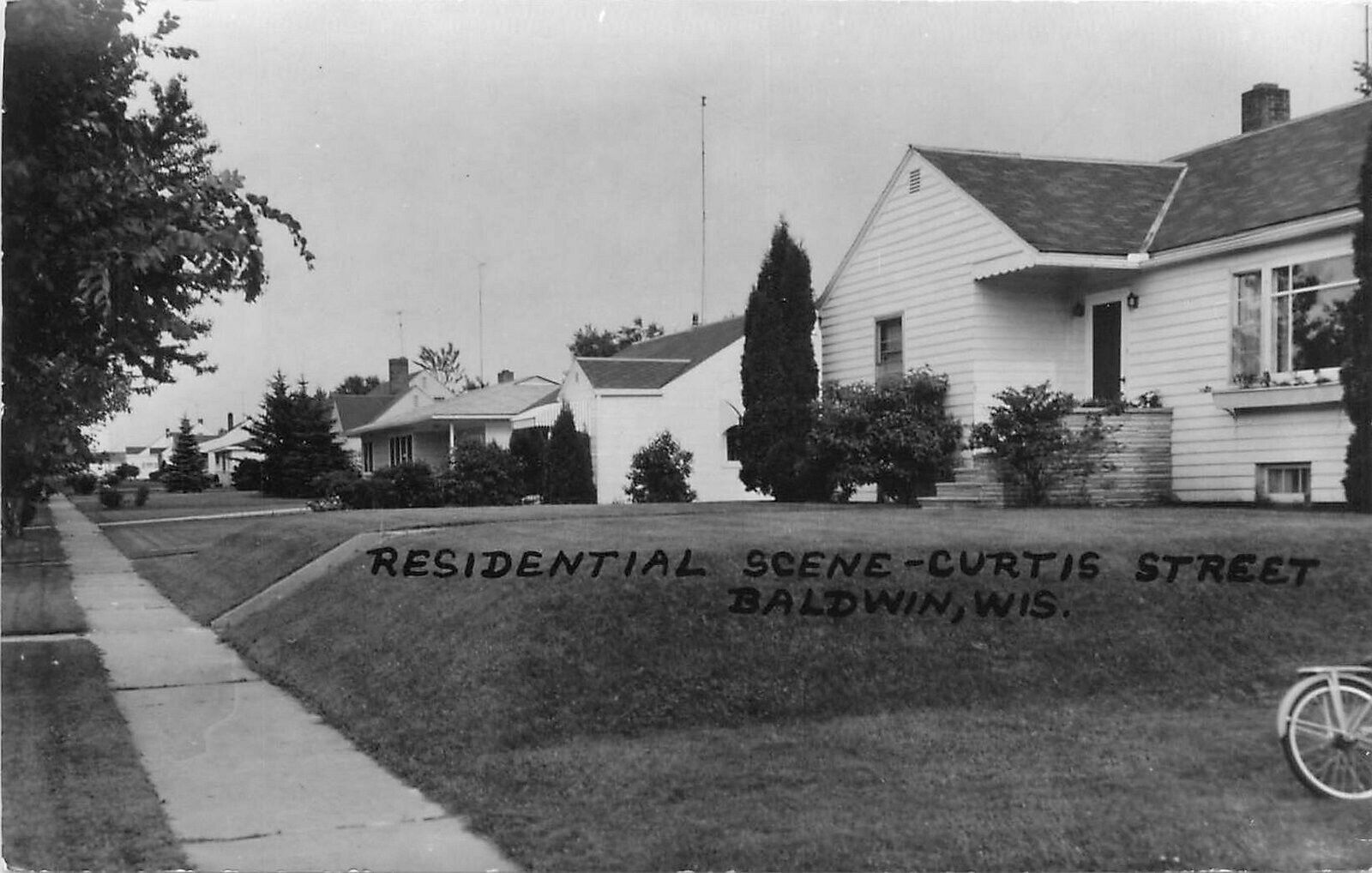 Postcard RPPC Wisconsin Baldwin Residential Curtis Street Bicycle 23-1189