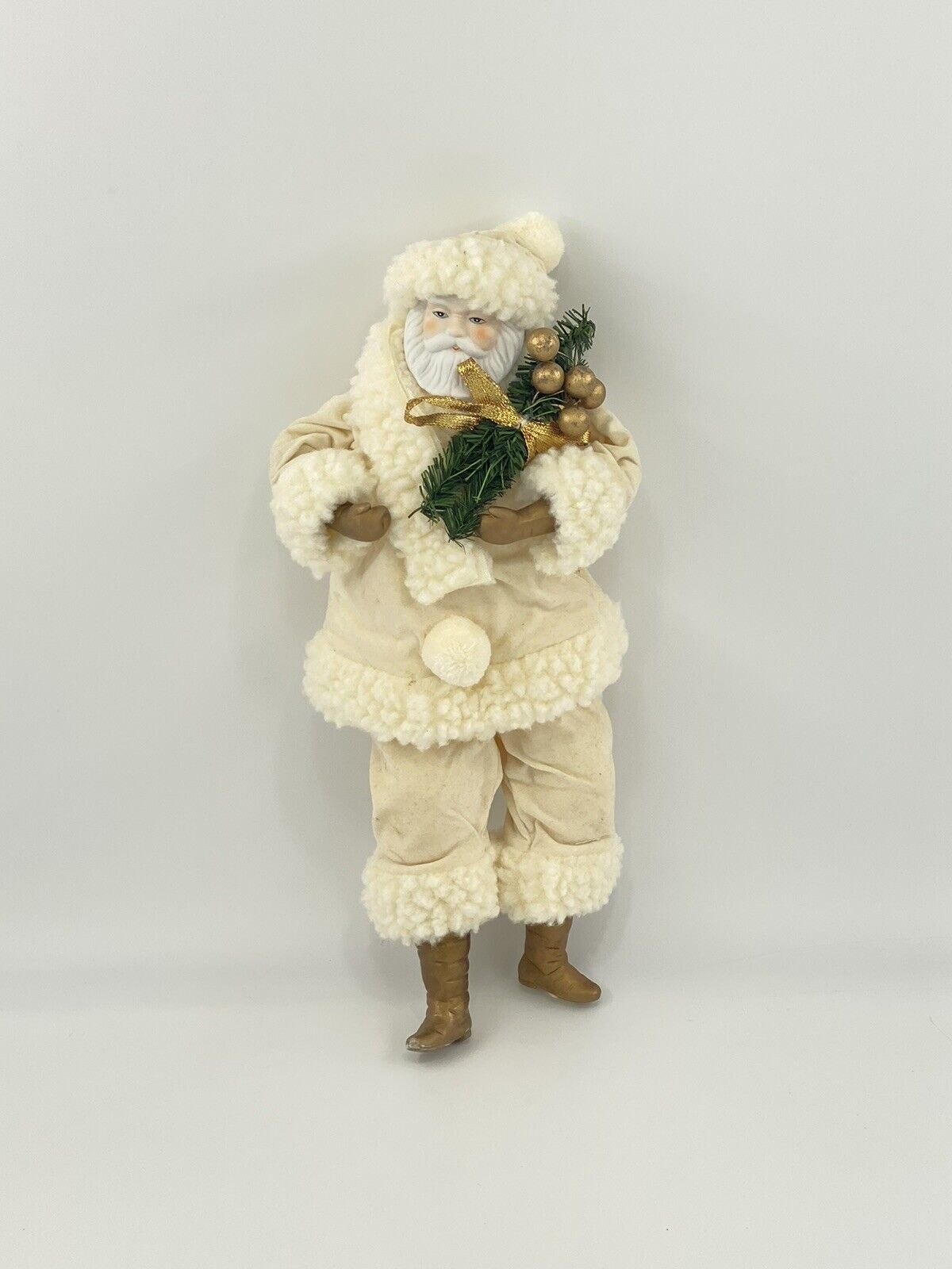 Village Art 16 Inch Santa In Cream Colored & White Suit Holding Holly