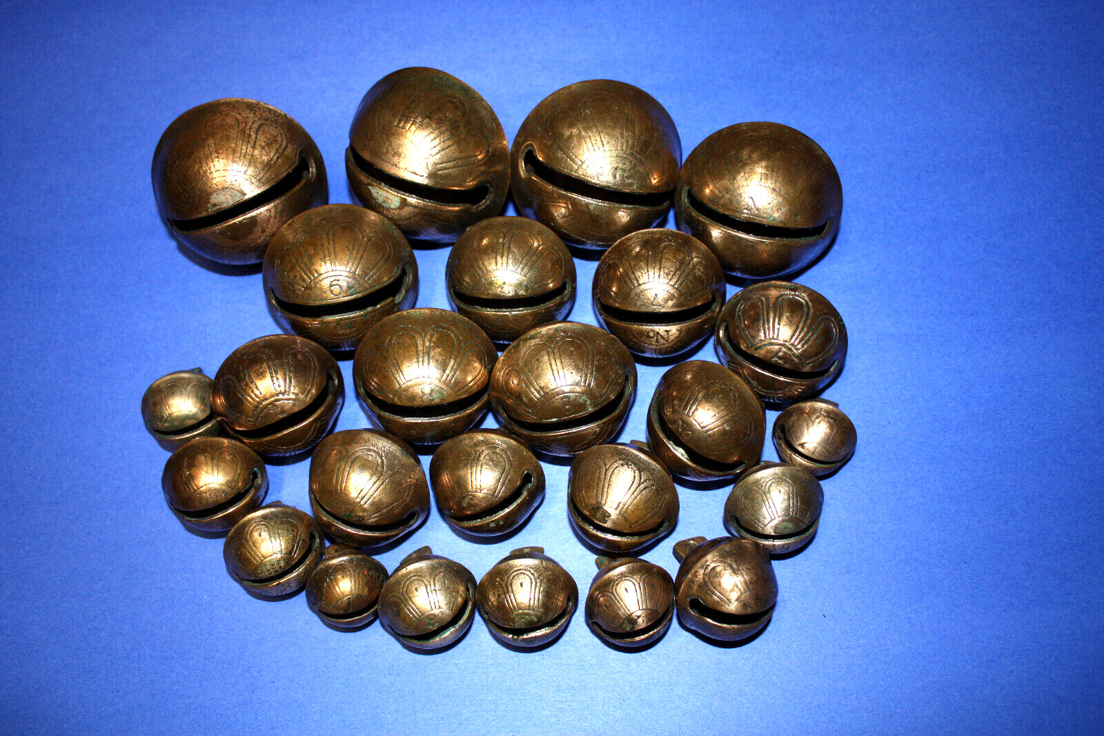 Antique 1800s   (25)  Petal style Brass Sleigh Bells.  Some very large.
