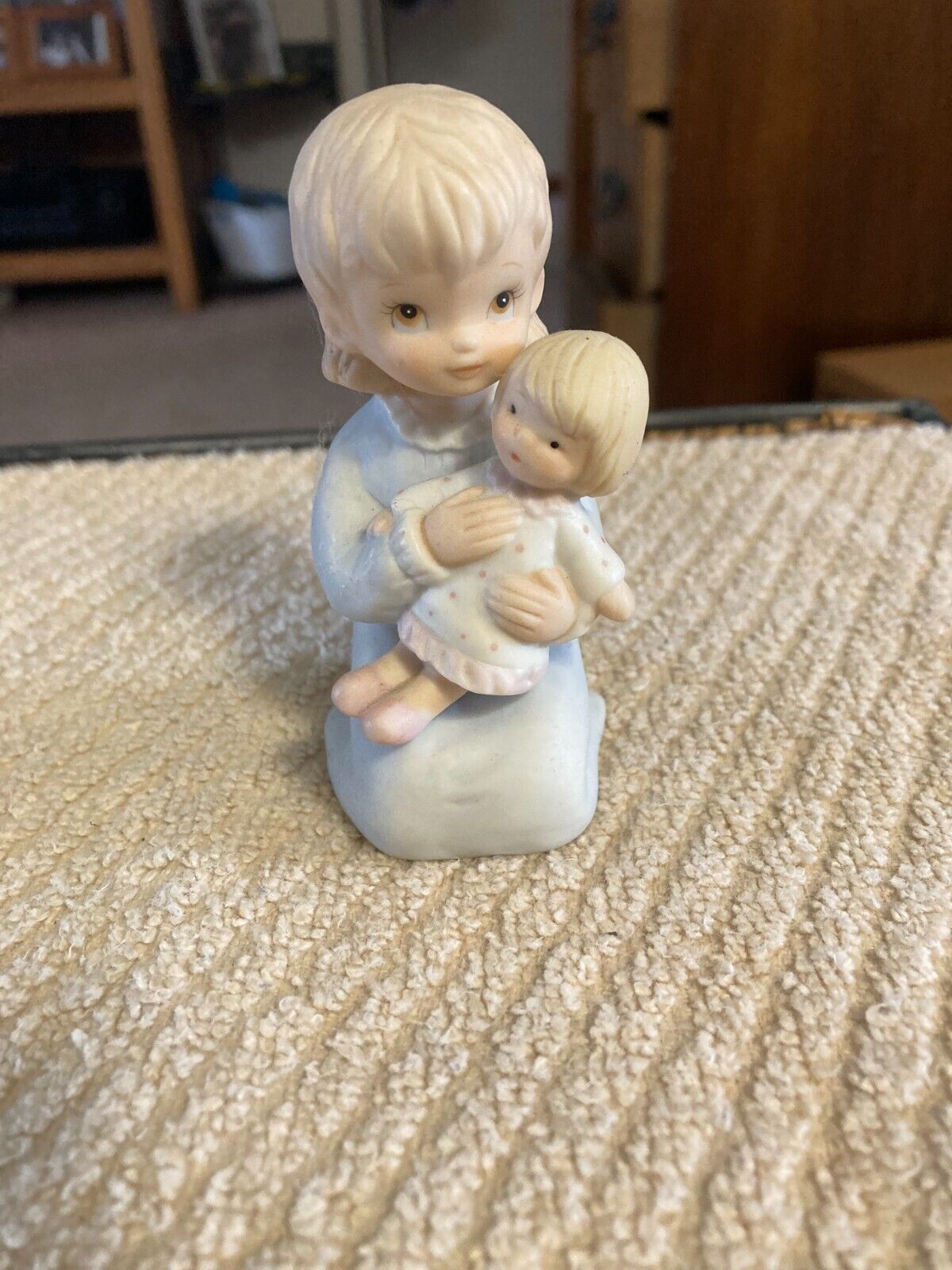 preowned 1982 girl holding doll,figurine form christopher , lifton collection