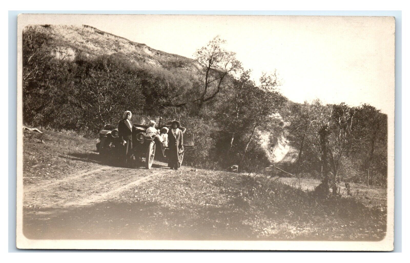 Postcard Family stops along road antique auto RPPC L12
