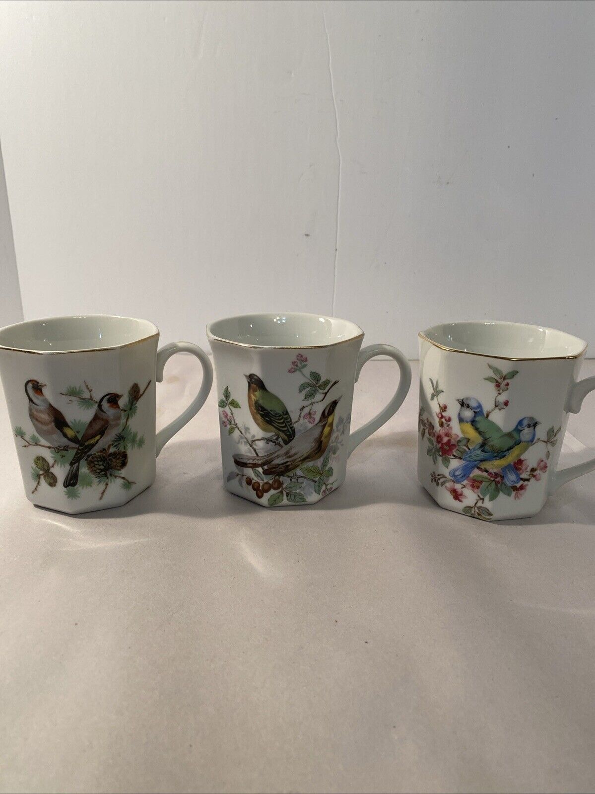 3 Porcelain birds with floral tea /coffee Cups