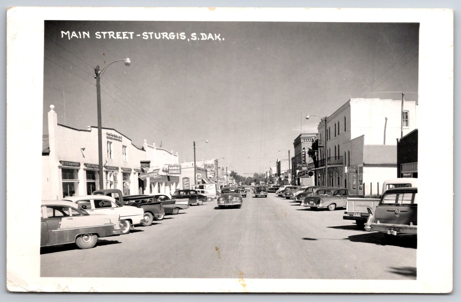 Sturgis SD~Main St~Chevrolet Bel-Air Dealer~Hotel Fruth~Gamble Stores~RPPC c1950