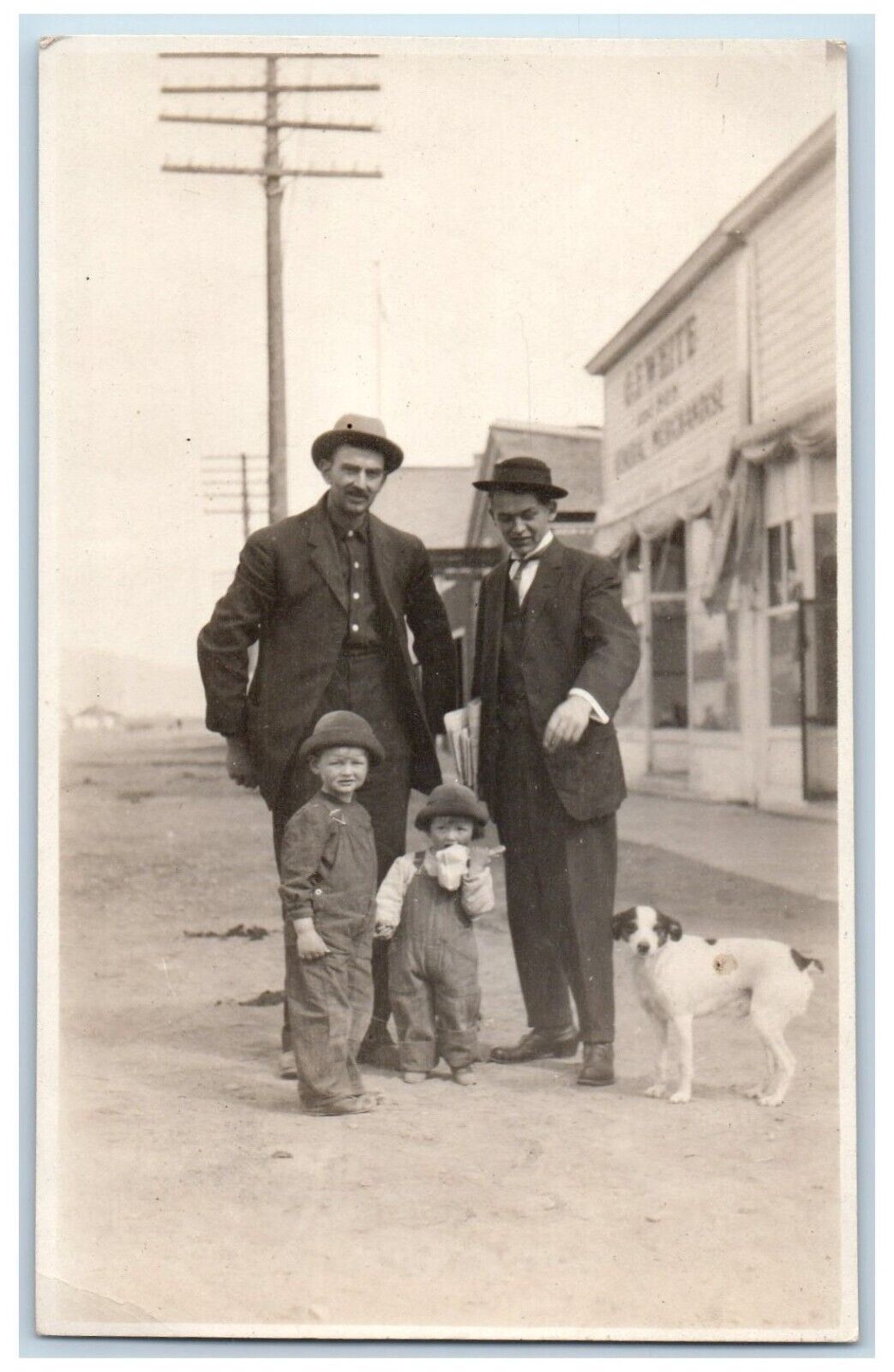 c1910\'s Children Terrier Dog Dirt Road Stores RPPC Photo Antique Postcard