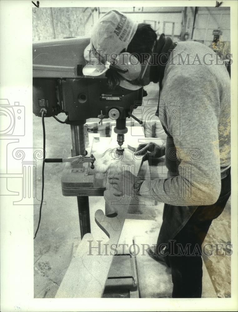 1987 Press Photo Worker cutting wood for LL Bean at Workshop, Inc., Menands, NY