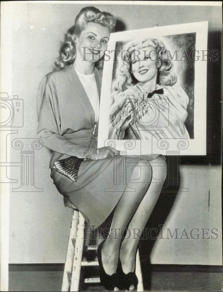 1943 Press Photo Actress Dolores Moran holds her soldier inspired drawing