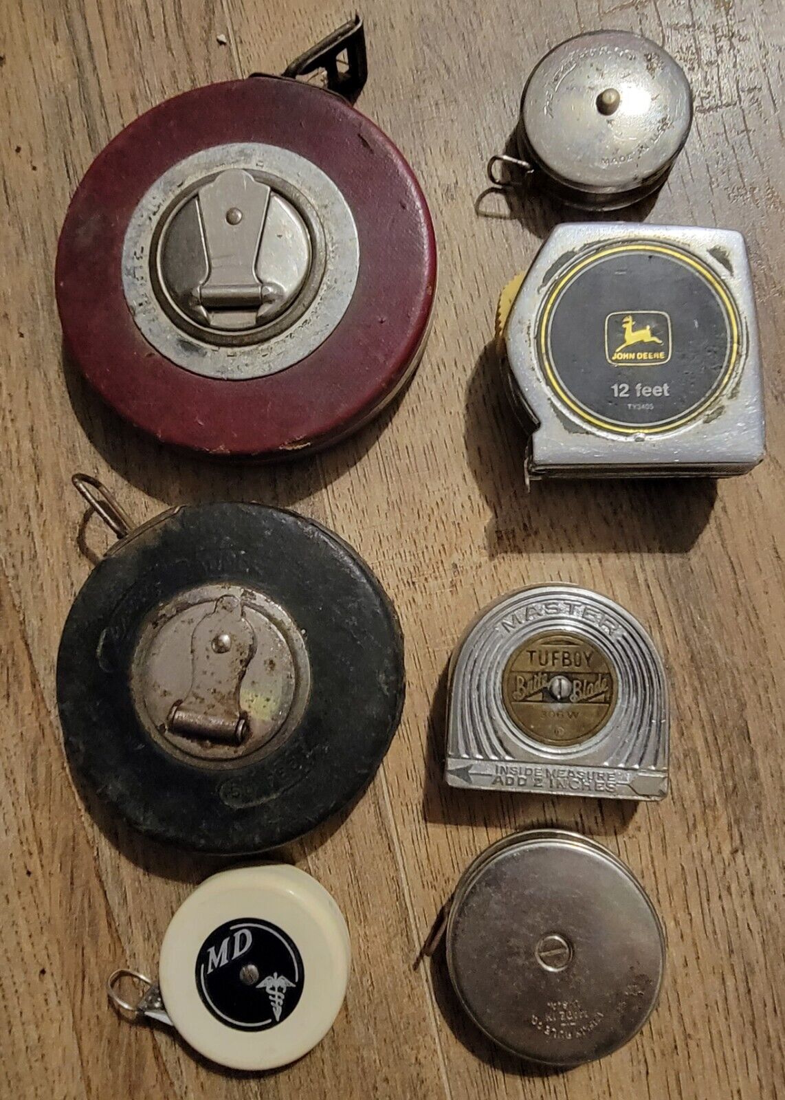 lot of 8 vintage tape measures:  lufkin , John Deere , Gambles