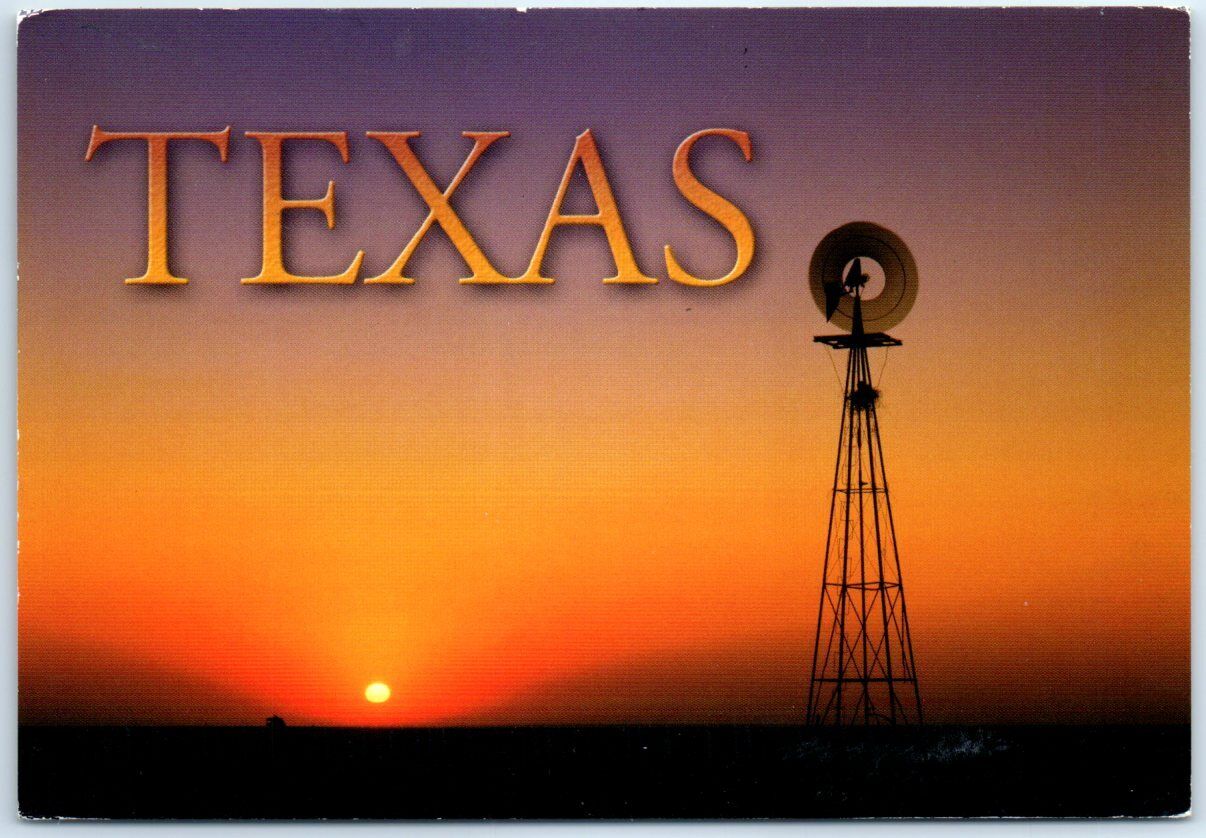 Postcard - A windmill is silhouetted against the sunset - Texas