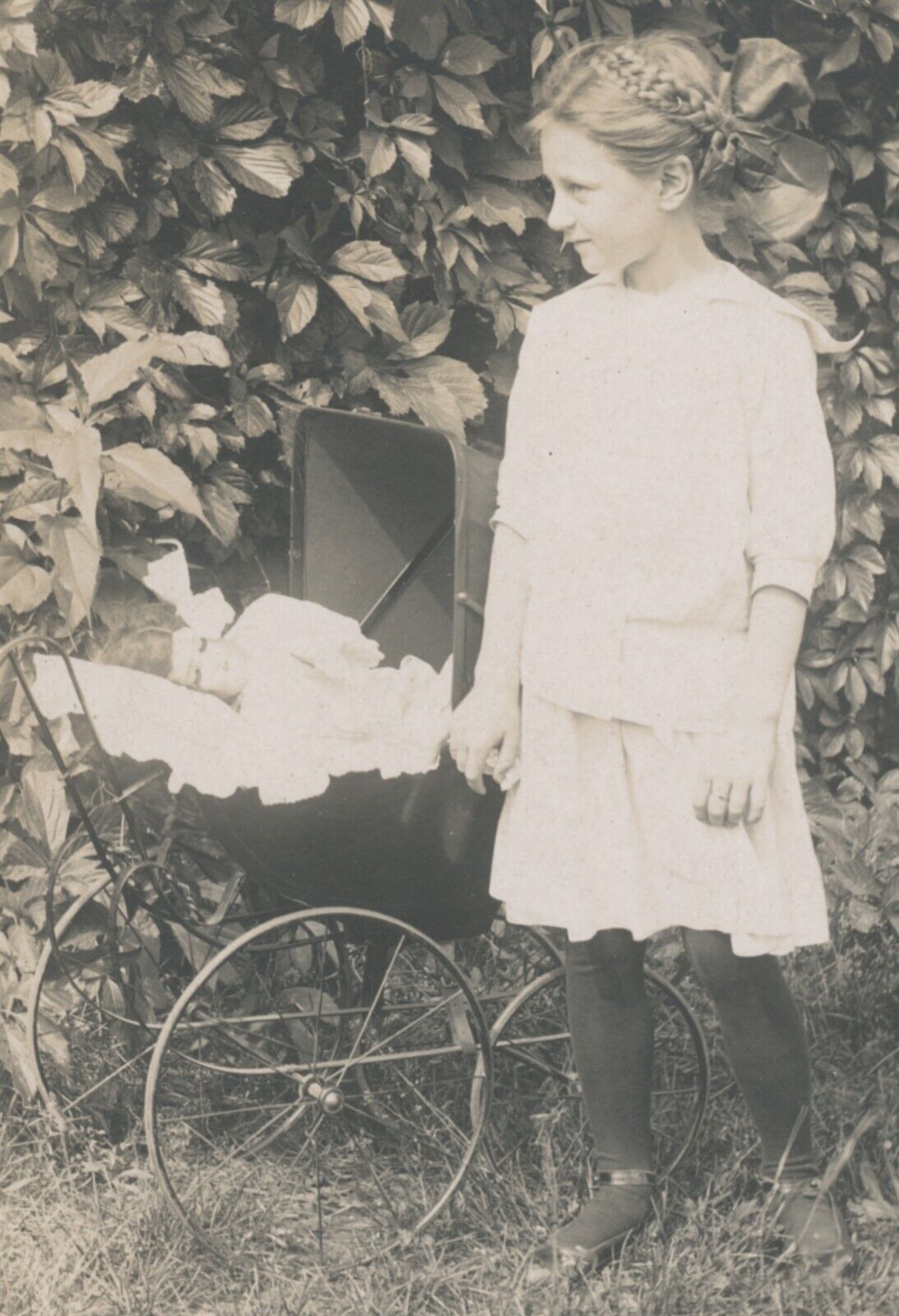 RPPC Young Girl with Doll In Buggy c1915 Real Phot Postcard