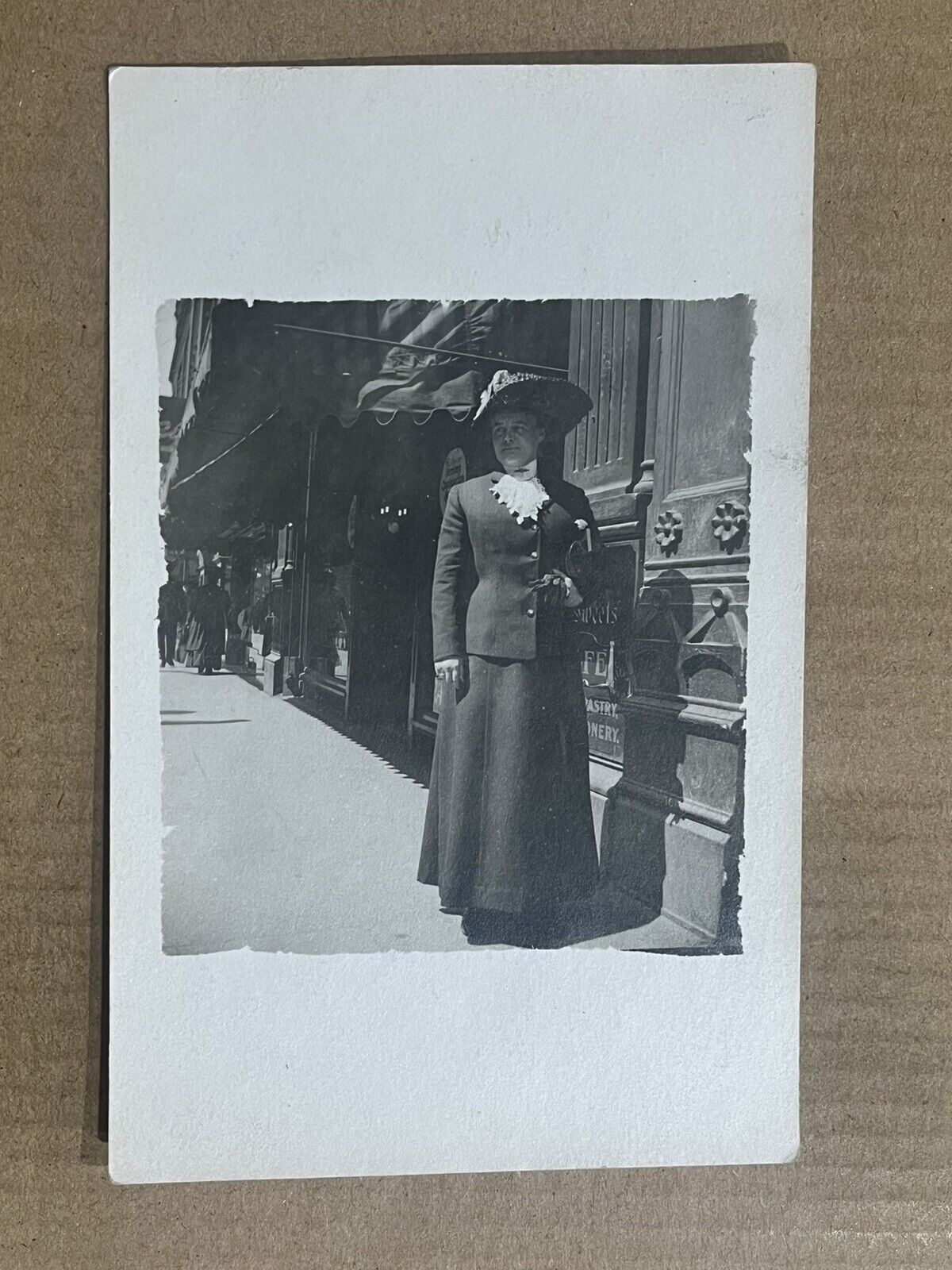 Postcard RPPC Woman Dress Big Hat City Sidewalk Street Scene Vintage Real Photo