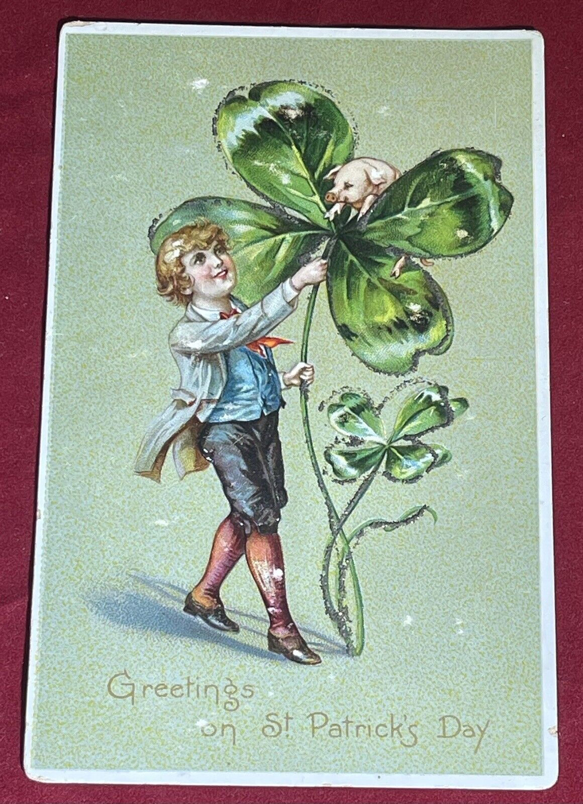 Vintage St. Patricks Day Greetings Boy Holding Giant Shamrock Pig Tucks Postcard