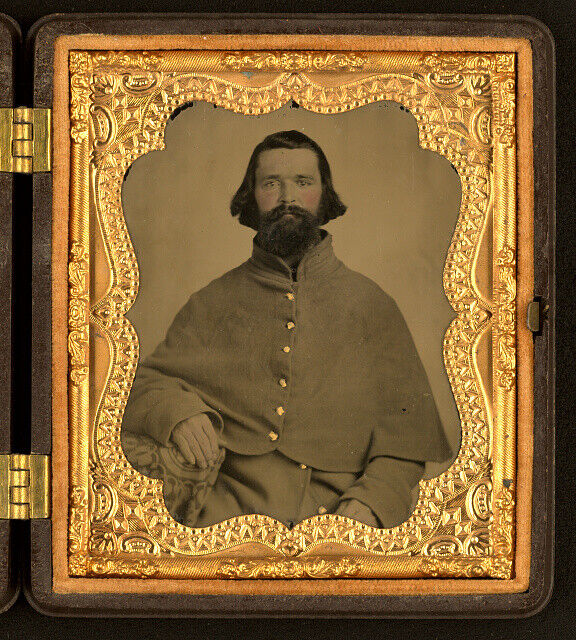 Photo:Unidentified soldier in Confederate uniform with great coat