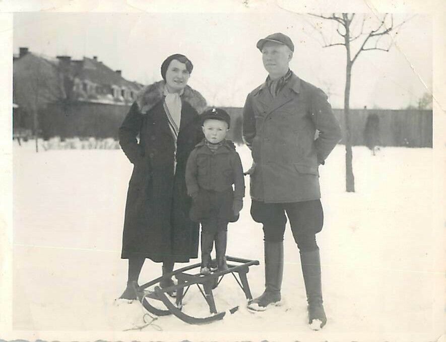 1930s German Couple with Young Child Standing on Sled Snow Village B&W Photo