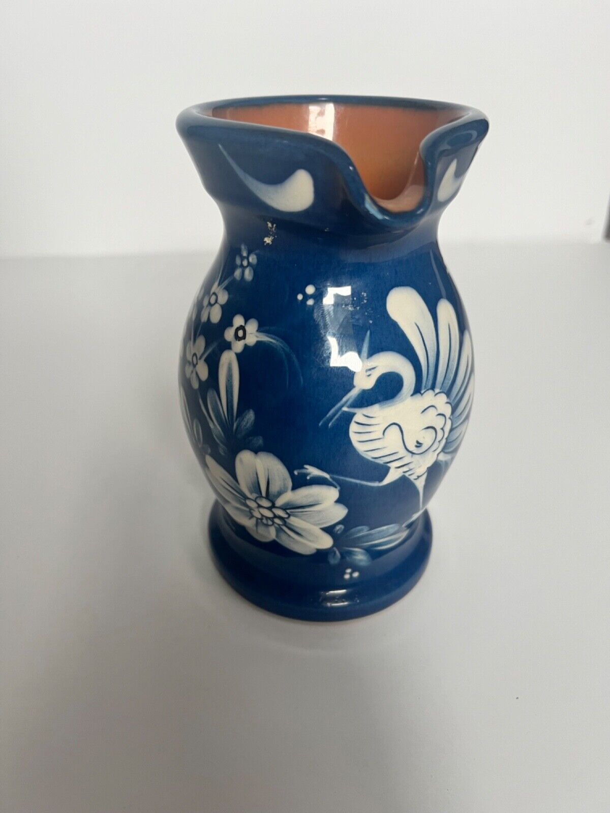 Vintage blue, white and orange pitcher. Handcrafted/painted. 6 inches tall