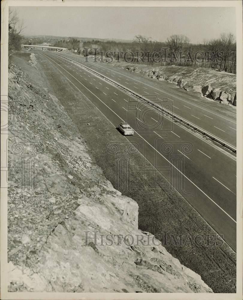 1957 Press Photo Rock cut along on Massachusetts Turnpike in Framingham
