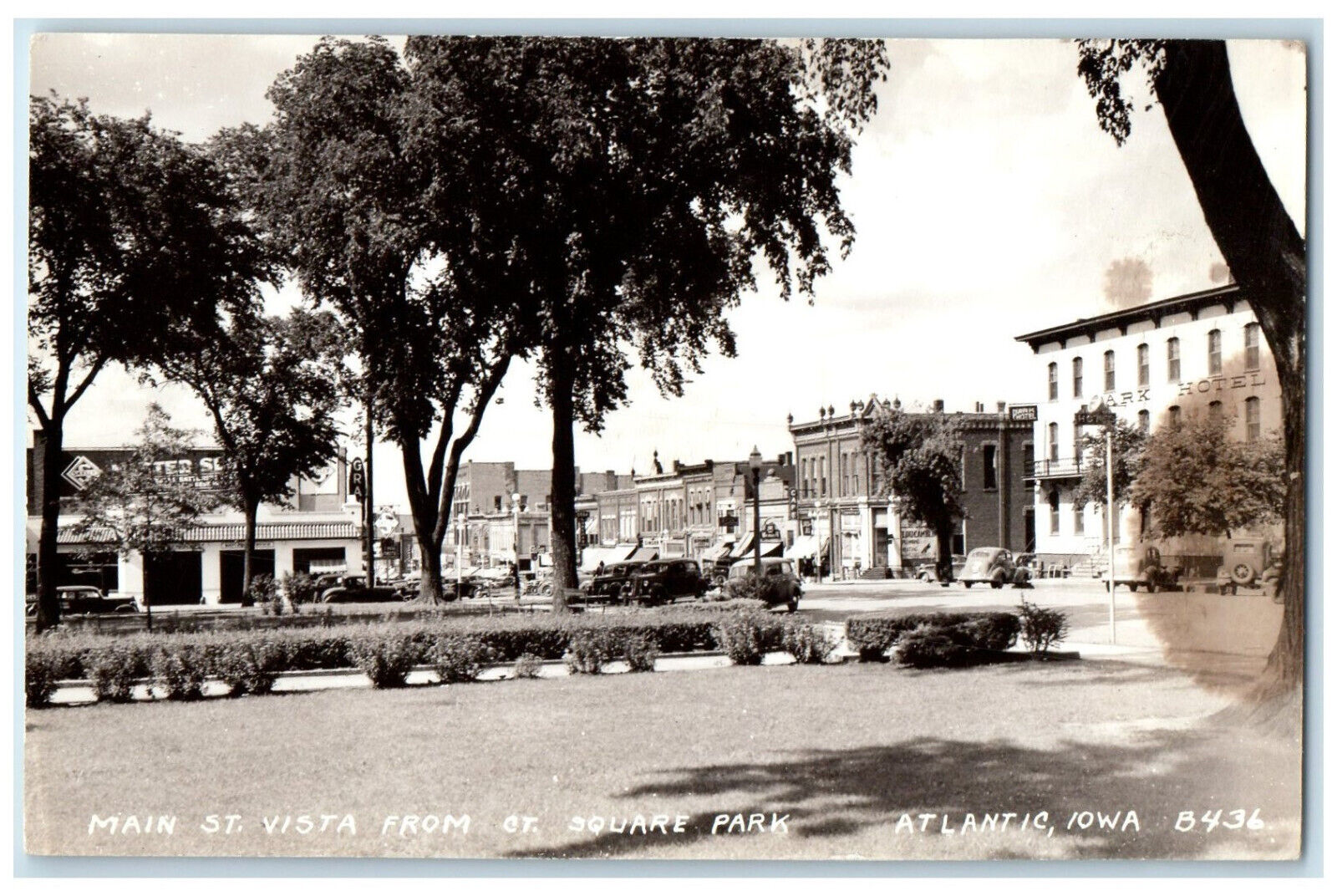 Atlantic Iowa IA RPPC Photo Postcard Main Street Vista from Square Park c1950's