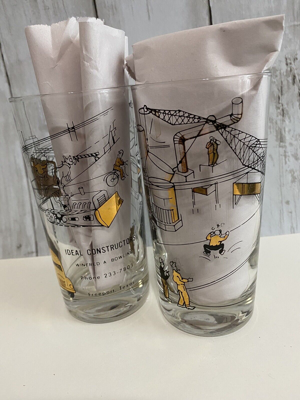 Two MCM Construction Advertising Black Gold Atomic Drinking Glasses Freeport TX
