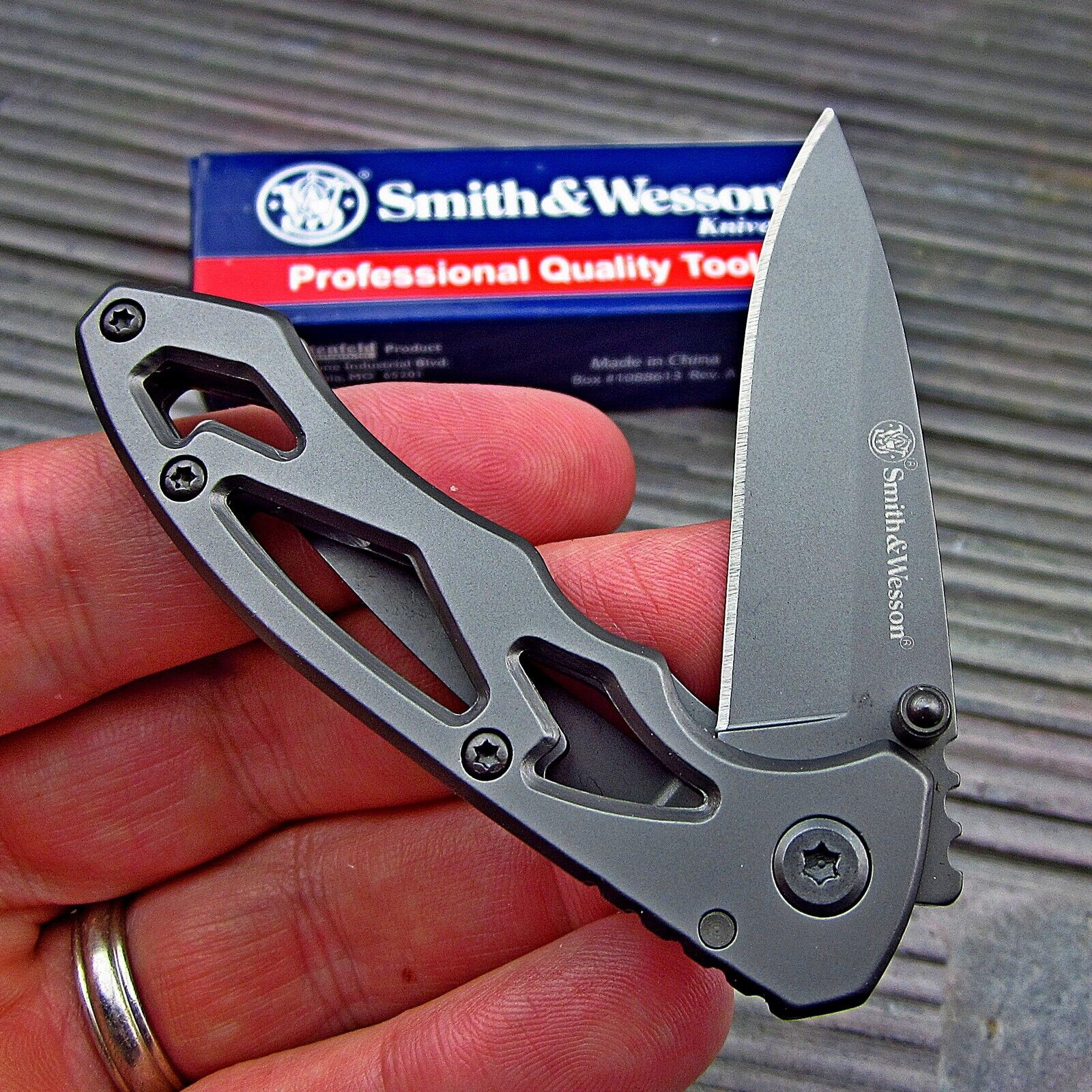 Smith & Wesson Small Titanium Drop Point Blade Skeletonized Folding Pocket Knife