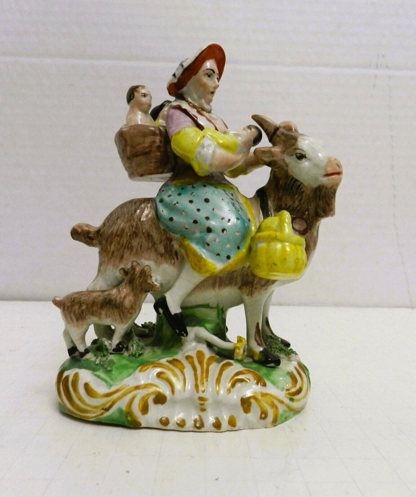 DD-28 -  ANTIQUE 19TH PEARLWARE STAFFORDSHIRE WOMAN RIDING GOAT \