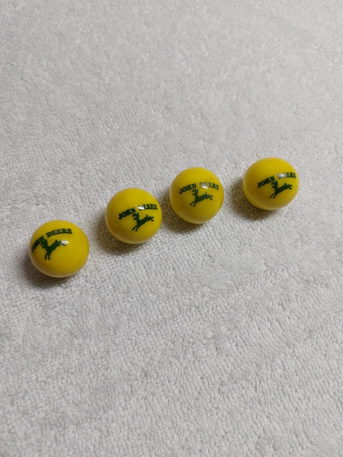 4 Vintage John Deere Yellow and Green Advertising Marbles
